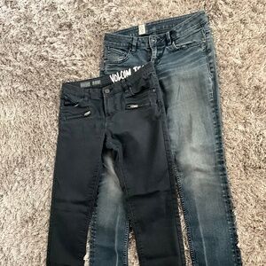 2 pair VOLCOM women jeans size 27”. Dark blue denim pair and black pair.